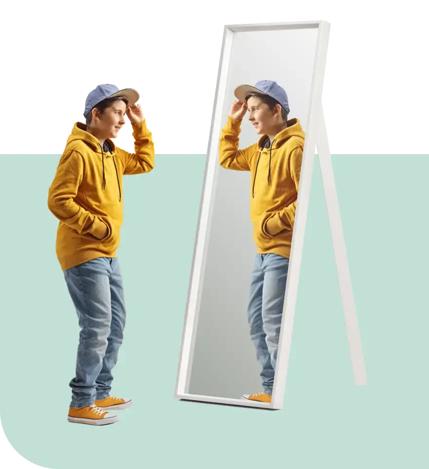 A person wearing a yellow hoodie, light blue jeans, yellow sneakers, and a light blue cap examines their reflection in a full-length mirror. Amid the serene, light turquoise background, they ponder deeper issues beneath the surface appearance.
